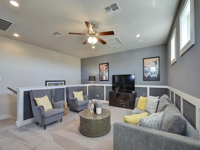 living room featuring carpet and ceiling fan