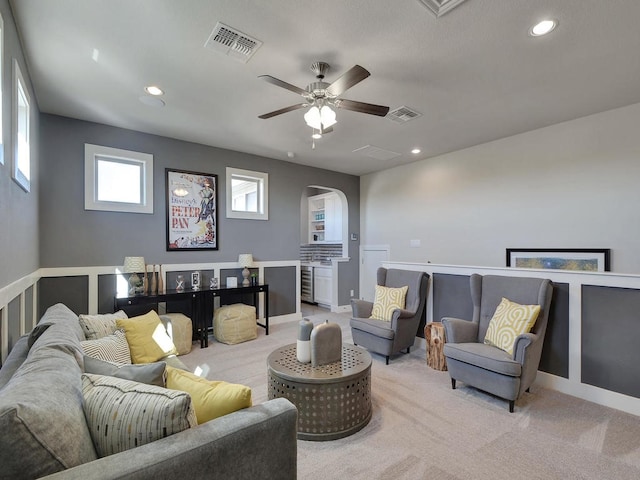 20517 Martin Ln, Pflugerville, TX 78660 - living area with arched walkways, a ceiling fan, recessed lighting, light carpet, and baseboards