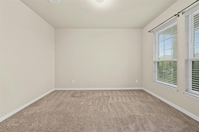 unfurnished room featuring carpet floors