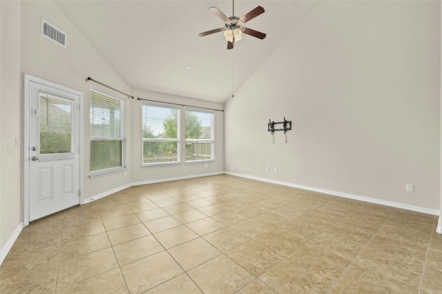 tiled spare room featuring ceiling fan and lofted ceiling