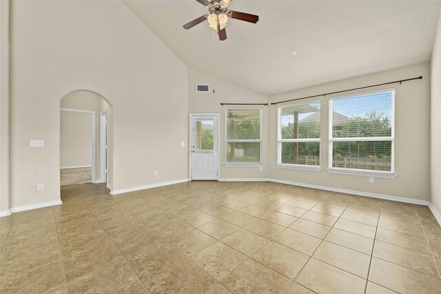 spare room with high vaulted ceiling, ceiling fan, and light tile patterned flooring