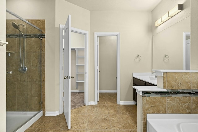 bathroom featuring separate shower and tub and vanity