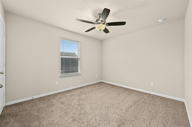 empty room featuring carpet and ceiling fan