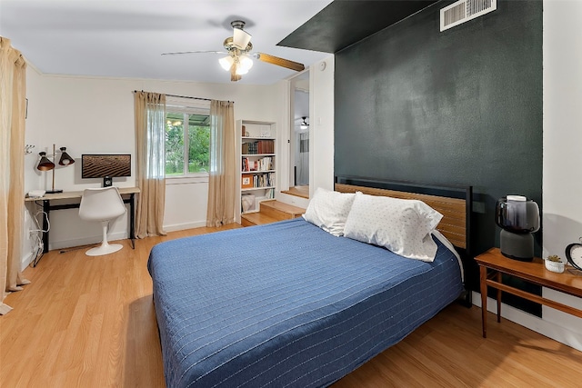 bedroom featuring light hardwood / wood-style floors and ceiling fan