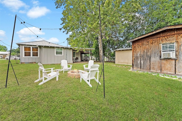 view of yard featuring an outdoor fire pit