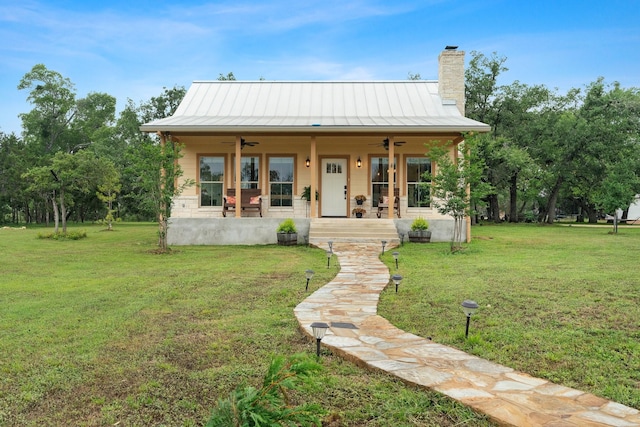 1451 Gatlin Creek Rd E, Driftwood, TX 78619 - view of front of property featuring a porch, ceiling fan, and a front lawn