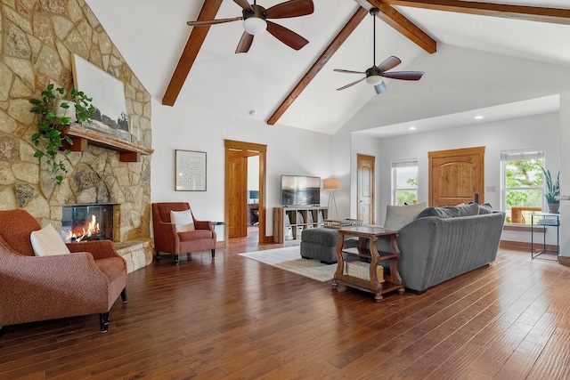 1451 Gatlin Creek Rd E, Driftwood, TX 78619 - living room featuring dark hardwood / wood-style floors, high vaulted ceiling, beamed ceiling, and a fireplace
