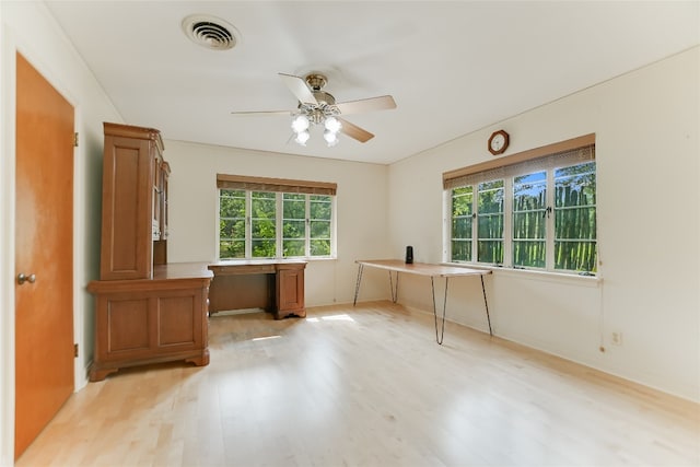 unfurnished office featuring ceiling fan and light hardwood / wood-style floors