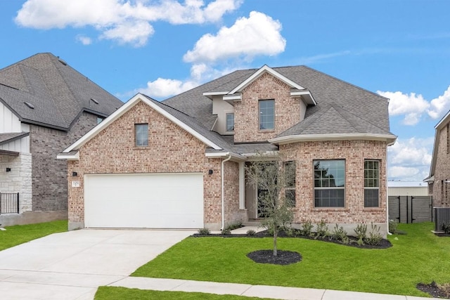 view of front of home featuring a front yard and a garage