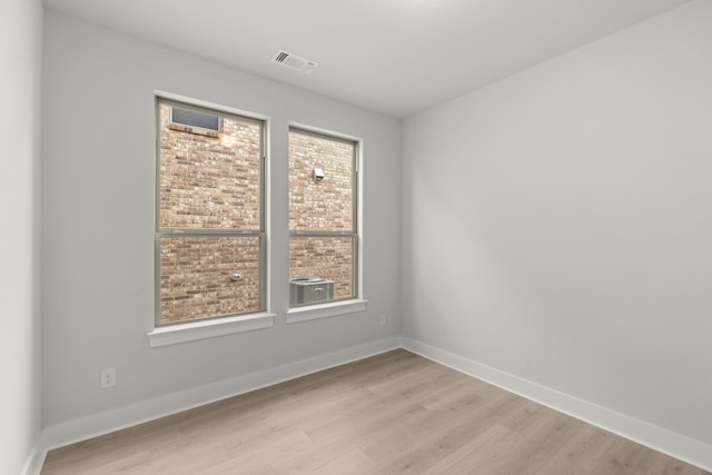 unfurnished room featuring light wood-type flooring