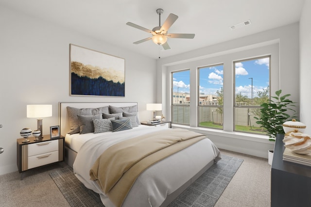 carpeted bedroom with ceiling fan