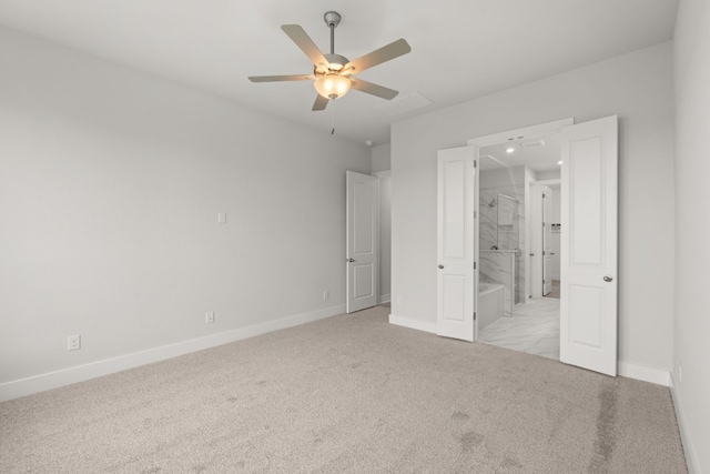 unfurnished bedroom featuring light carpet, ensuite bathroom, and ceiling fan