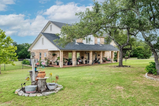 back of property featuring a yard and a patio