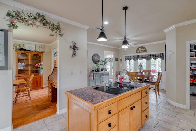 kitchen featuring ornamental molding, black electric cooktop, ceiling fan, light brown cabinets, and light hardwood / wood-style floors