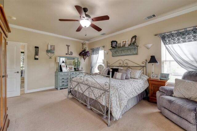 carpeted bedroom featuring ceiling fan and ornamental molding