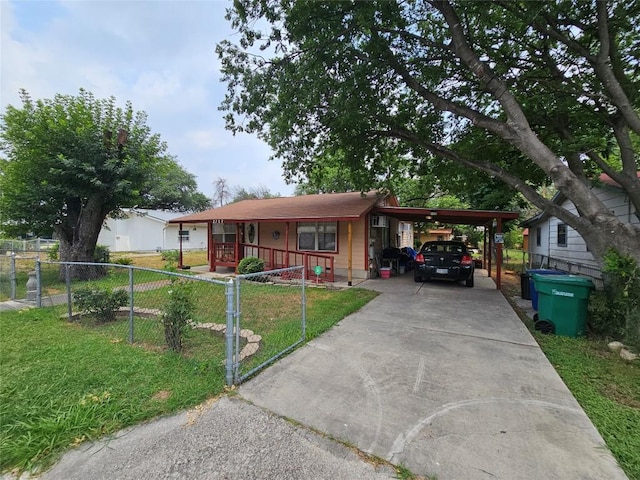 ranch-style home featuring a carport, a porch, and a front lawn