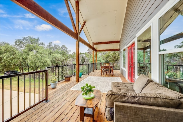 wooden terrace with outdoor lounge area