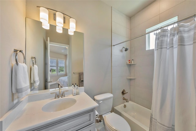 full bathroom with shower / bathtub combination with curtain, toilet, and vanity with extensive cabinet space