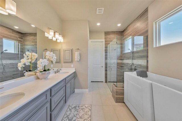 bathroom featuring walk in shower, double sink vanity, and tile floors