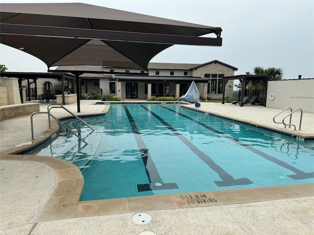 view of swimming pool featuring a patio