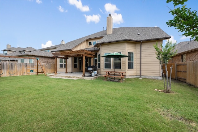 back of property featuring a yard and a patio