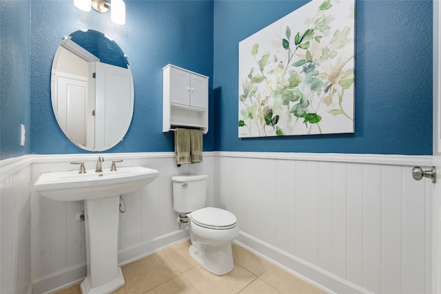 bathroom with tile patterned floors and toilet