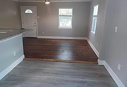 interior space with dark hardwood / wood-style floors and crown molding