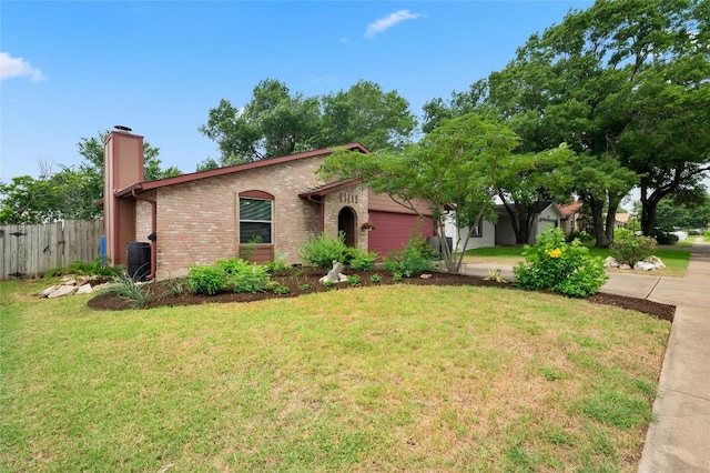 view of front of house with a front lawn and a garage