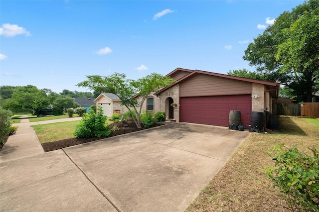 view of front of property with a garage and a front yard