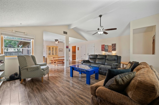 living room with a textured ceiling, lofted ceiling with beams, hardwood / wood-style flooring, and ceiling fan