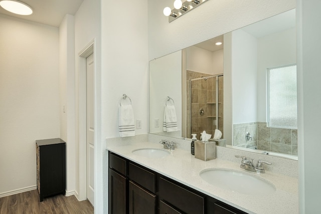 bathroom featuring wood-type flooring, vanity, and separate shower and tub