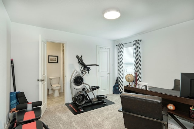 exercise room with light colored carpet