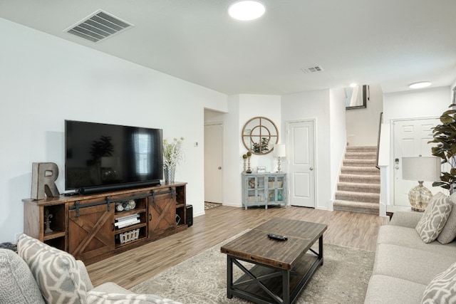 living room with light hardwood / wood-style floors