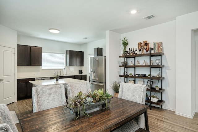 dining space featuring wood-type flooring