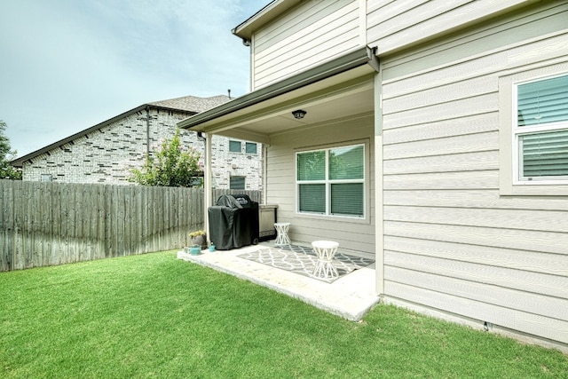 exterior space with a lawn and a patio