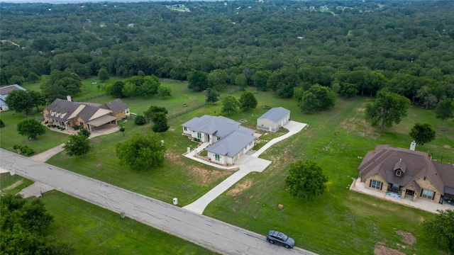 bird's eye view featuring a forest view