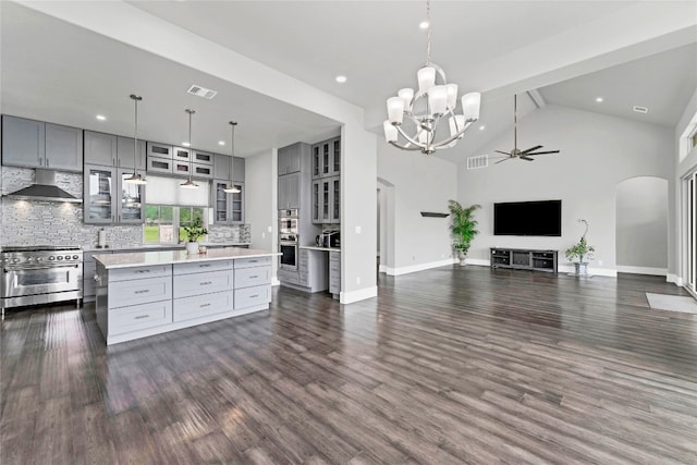 kitchen featuring a center island, stainless steel appliances, extractor fan, and gray cabinetry