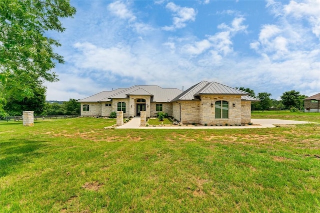 ranch-style home with a front lawn