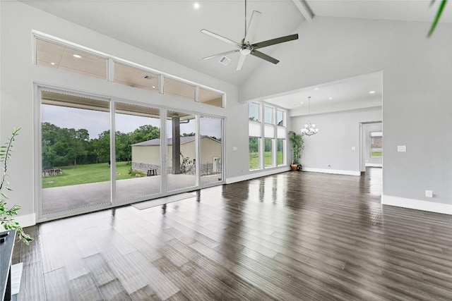 unfurnished living room featuring ceiling fan with notable chandelier, high vaulted ceiling, baseboards, and wood finished floors