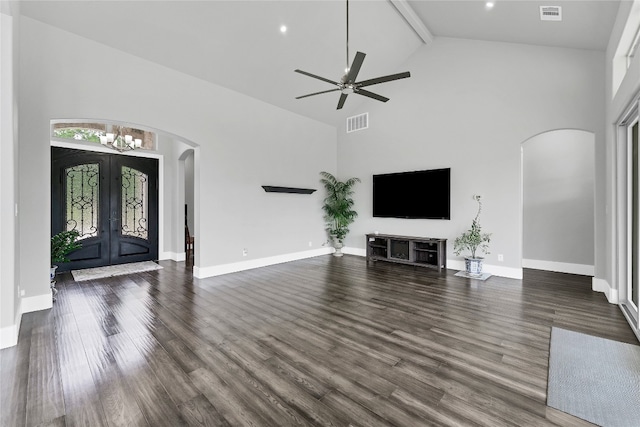 unfurnished living room featuring ceiling fan, dark wood-type flooring, high vaulted ceiling, and french doors