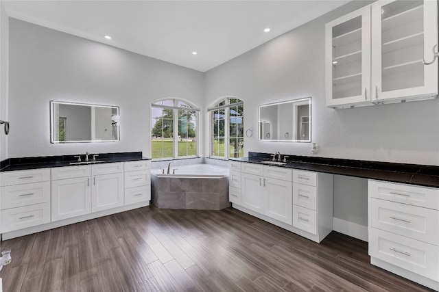 interior space with white cabinets, sink, and dark wood-type flooring