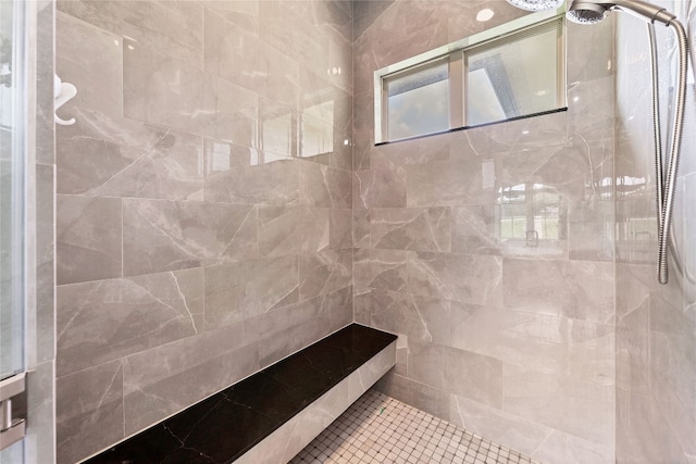 bathroom featuring tiled shower