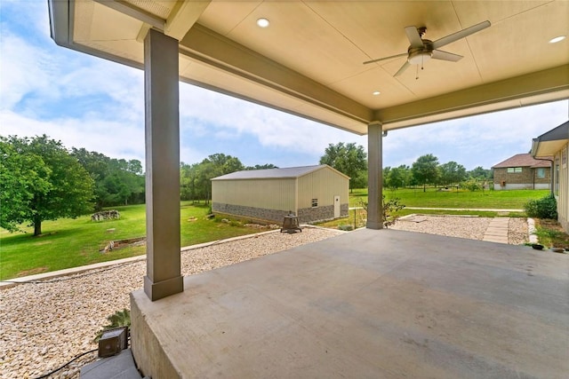 view of patio / terrace with an outdoor structure and ceiling fan