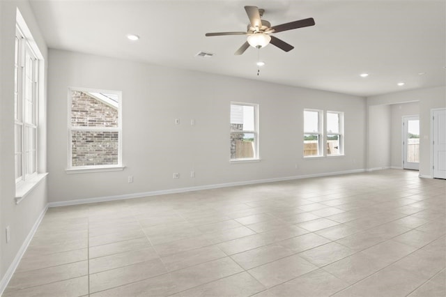 empty room featuring ceiling fan and light tile patterned flooring