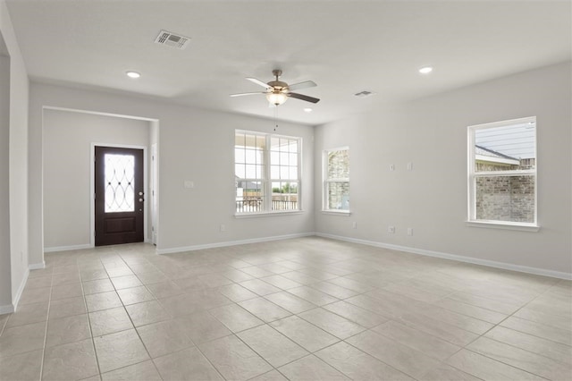 interior space featuring plenty of natural light and ceiling fan