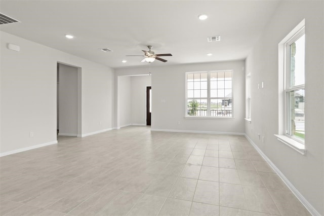 unfurnished room featuring ceiling fan and light tile patterned flooring