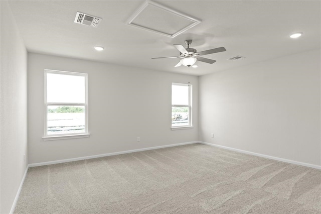 empty room featuring carpet and a wealth of natural light