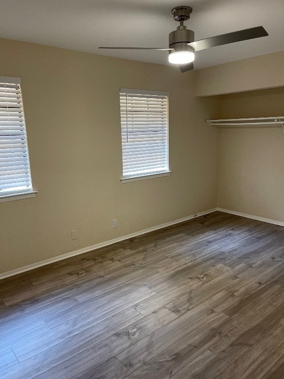 interior space with ceiling fan and wood-type flooring