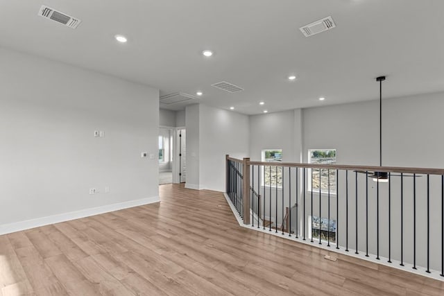 spare room featuring light hardwood / wood-style floors