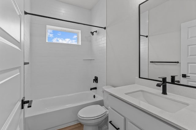 full bathroom with vanity, toilet, wood-type flooring, and bathtub / shower combination